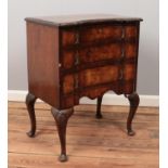 A Queen Anne style walnut chest of drawers raised on cabriole supports. Some veneer missing.