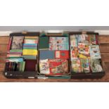 Three boxes of assorted books, guides and collector cards. To include Ladybird and Brooke Bond