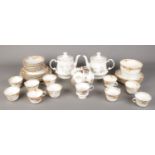 A box of dinner/teawares. Including Elizabethan teapots, floral pattern dinnerwares, etc.