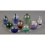 Nine decorative glass paperweights. Includes Caithness, Tweedsmuir etc.