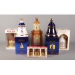 Five boxed and sealed bottles of assorted Bell's whisky along with three small miniatures. To