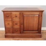 A walnut side cabinet with six drawers and cupboard.