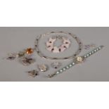 A collection of silver and white metal jewellery, to include marcasite set necklace, rose quartz