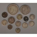 A small quantity of silver coins. Including 1919 half crown, James II 1686 two pence, etc. 39.33g.