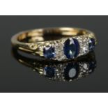 An 18ct Gold, Platinum Sapphire and Diamond seven stone ring. Size LÂ½. Total weight: 3.36g