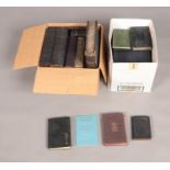Two boxes of religious books including several The Holy Bible, The Book of Mormon and various