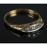 An early 20th century 18ct gold & platinum diamond five stone boat set ring. Size N. 2.97g.