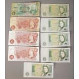 A collection of British bank notes. Includes Ten Shilling notes and One Pound notes.