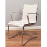 A chrome easy arm chair. Stitching loose on seat.