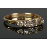 An 18ct Gold carved half hoop five stone old European cut diamond ring. Approximately 0.65cts in