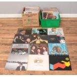 Two boxes of rock, pop and county vinyl records. To include Queen, Bryan Adams, Barry White, Diana