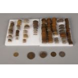 A collection of mostly pre-decimal British coins to include two George III Wheel Pennies, Shillings,