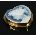 A hardstone cameo pendant/brooch, formed within an 18ct Gold heart-shaped mount.