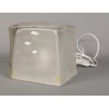 A 1990's Ikea Iviken melting ice cube lamp with frosted glass exterior.