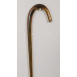 A coloured blown glass shepherd's crook. Length 135cm. Chip to base.