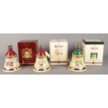 Three boxed and sealed Bell's 'Extra Special' Christmas Whisky Decanters; from 1996-1998.