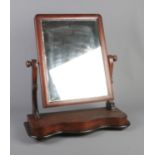 An adjustable plain plate dressing table mirror. Dimensions including frame approx. 53cm x 60cm.