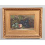 A late 19th/early 20th century oil, still life of fruit. Signed indistinct. 19cm x 30cm.