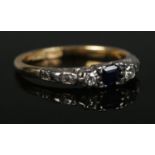 An 18ct Gold and Platinum Art Deco sapphire and diamond ring, with single cut diamond and caliber