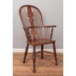 An ash/elm Windsor arm chair, with pierced splat and end turned supports.