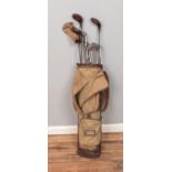 A quantity of vintage golf bags with bag. To include A. Whittaker Connoisseur, Mashie, Geo. Hughes