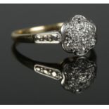 An 18ct Gold and Platinum set diamond cluster ring. Assayed for Birmingham 1978. Size Q. Total