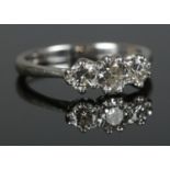 An 18ct White Gold and Three Stone Diamond ring (approximately 0.9ct in total). Assayed London,