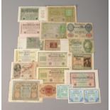 A selection of early Twentieth Century German banknotes and tokens, of various denominations.
