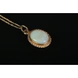 A 9ct Gold Opal pendant, on dainty 9ct Gold chain. Total weight: 1.41g.