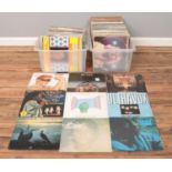 Two boxes containing a good collection of rock and pop vinyl records. To include Eurythmics,