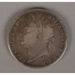 A George IV silver crown, dated 1821.
