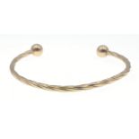 A 9KT stamped yellow gold open bangle width 6cm weight 4.42g approx