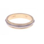 A 750 stamped yellow and white gold wedding band Size M, weight 4.52g