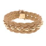 An EXQUISITE AND UNUSUAL design 750 stamped 18ct yellow gold four-way plaited bracelet with