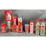 A large selection of COCA-COLA memorabilia to include 2 water bottles, a double-walled drinks can,
