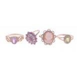 Four 9ct stamped dress rings, one cameo, an amethyst with open-scrolled shoulders, one with pale