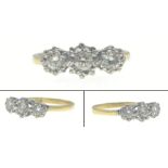 A 750 hallmarked 18ct yellow gold ring set with three illusion set diamonds (tested) Size O, gross