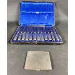 A set of twelve silver handled butter knives in fitted Edinburgh retailers case