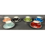 A vibrant set of collectable SUSIE COOPER bone china coffee cups and saucers