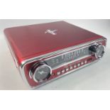 A FABULOUS Ford Mustang record player and radio in a vibrant cherry red colour, complete with plug