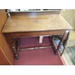 EDWARDIAN A SOLID OAK stretchered wall table with hand carved legs and features / 3ft length x