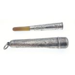 A SILVER CHESTER HALLMARKED 1926 cigarette Holder with bakelite tip and case- the case has a small