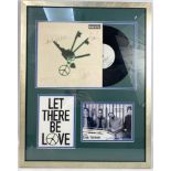 Framed OASIS autographs on a 'Let There be Love' record sleeve, with a band photo and poster frame