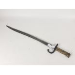 A late 19th century French military bayonet with brass handle stamped 7735 on the pommel, blade