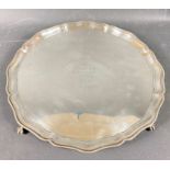 A large silver hallmarked (London 1928) Tudor-rose shaped tray with ball and claw shaped feet and