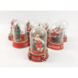 Eight COCA-COLA dome Santa figures to include 'Making a List', 'Time for a Coke', Please Pause