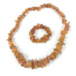 A BALTIC AMBER rough-cut bead necklace(132g approx) and bracelet(40g approx) set - necklace approx