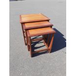 A RETRO set of three G-PLAN teak nest of tables - all in good condition - dimensions 19.5”