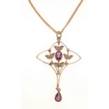 A vintage 9ct stamped amethyst and seed pearl pendant suspended from a 375 stamped yellow gold