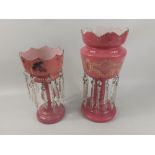 Two vintage pink glass mantle lustres complete with all suspended droplets 36 and 29cm tall